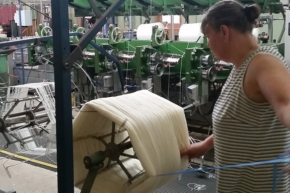 A worker at a yarn mill in Victoria
