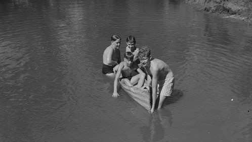 Boys in a canoe made of tin at Fairbridge 1950