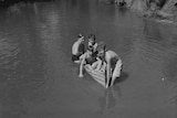 Boys in a canoe made of tin at Fairbridge 1950