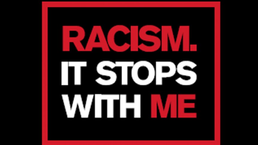 A graphic with the words, "Racism, it stops with me" in red and white capital letters on a black background