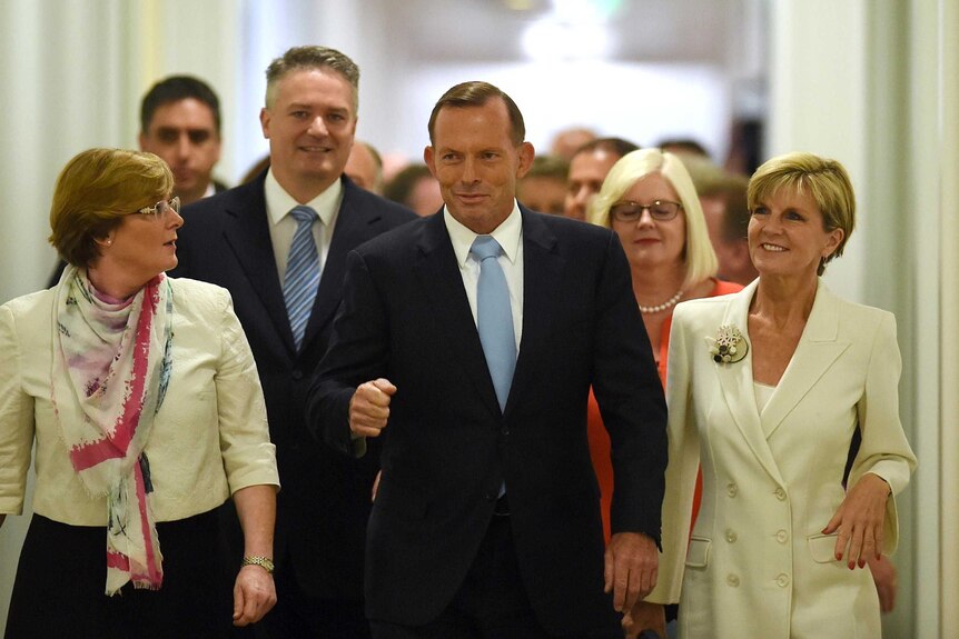 Prime Minister Tony Abbott and fellow MPs arrive at Parliament House