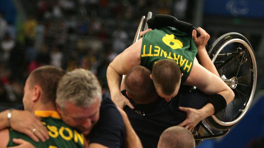 Australia celebrates after defeating Canada to win gold in the men's wheelchair basketball.