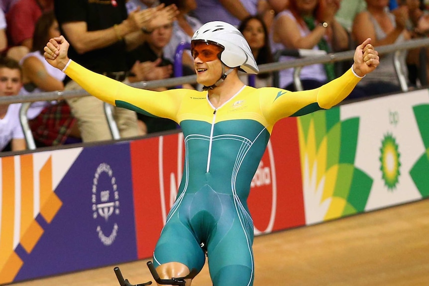 Australian cyclist Scott Sunderland celebrates after winning the men's kilo time-trial.
