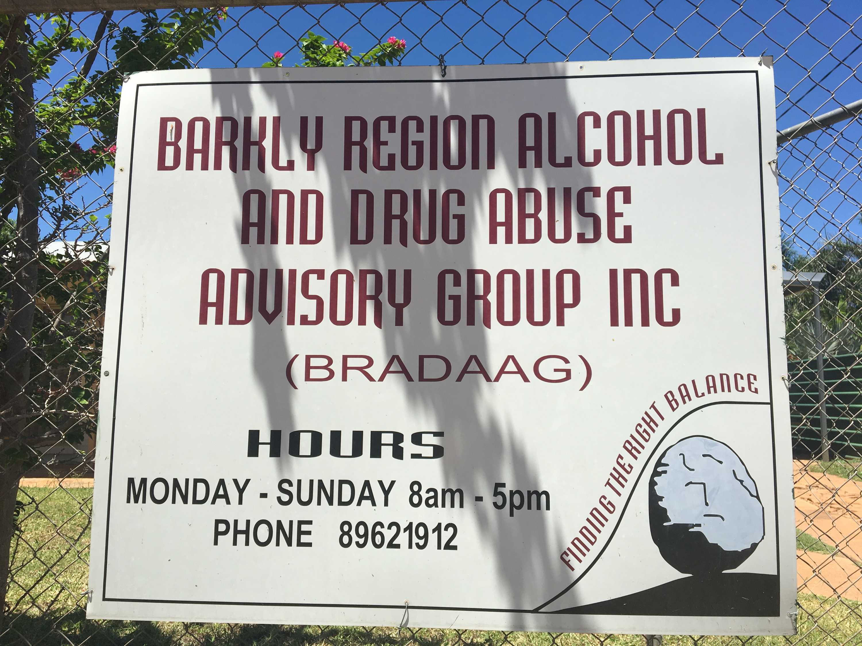 A white sign with red writing reads: Barkly Region Alcohol and Drug Abuse Advisory Group.