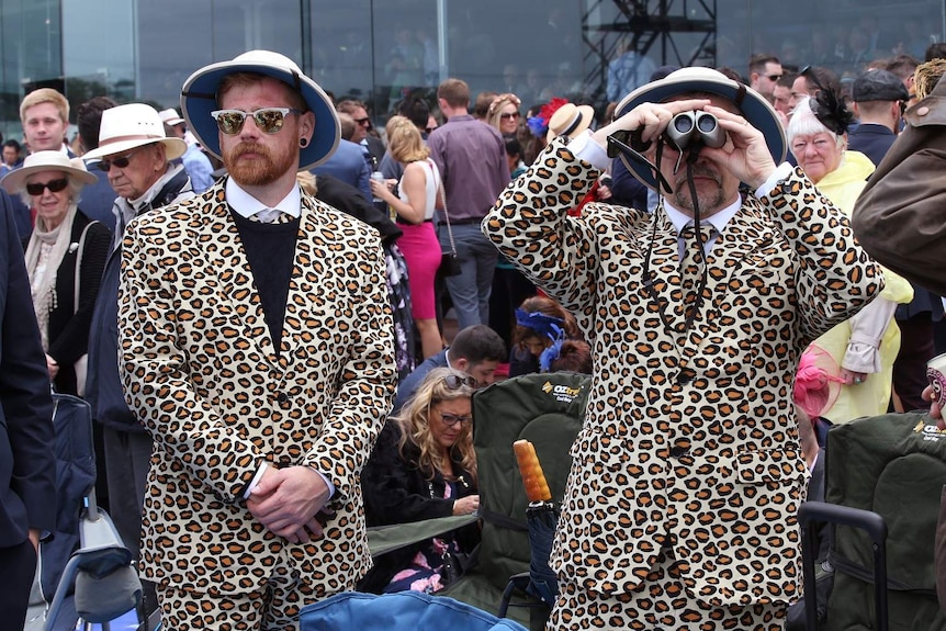 Melbourne Cup racegoers in leopard print suits.