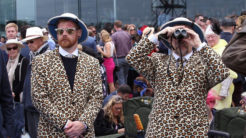 Melbourne Cup racegoers in leopard print suits.