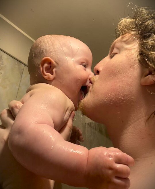 Anton Gower showering with son Elijah Neilson-Gower.