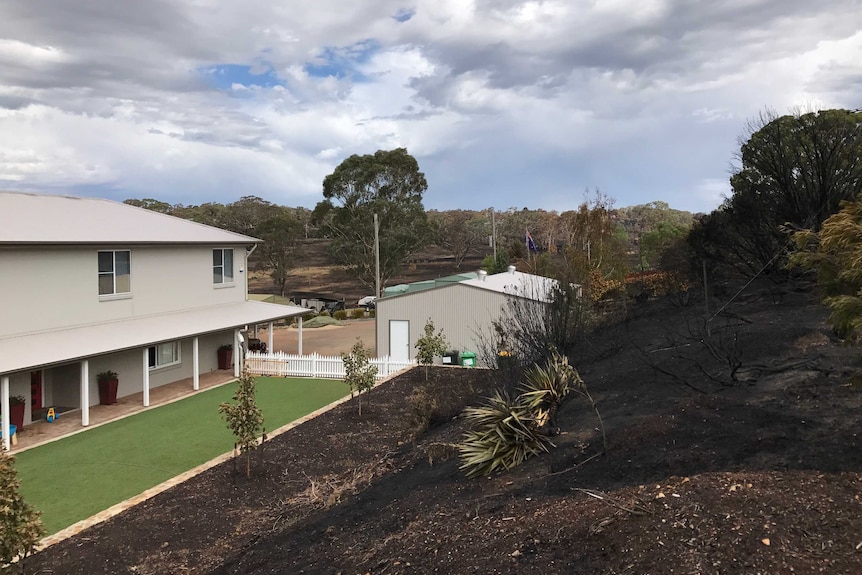 The fire came within metres of Glenn and Alex's Carwoola home.