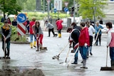 Residents clean the streets in Greiz, eastern Germany.