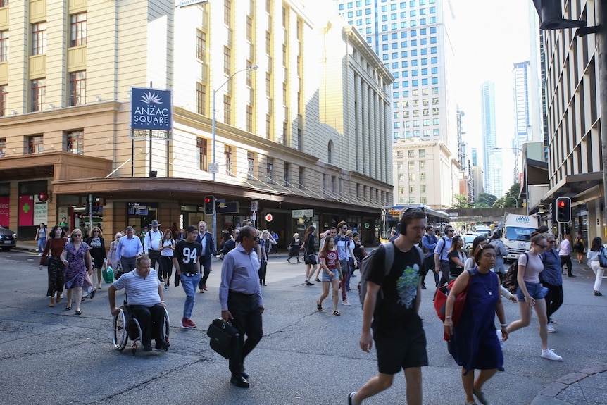 A busy Brisbane CBD scramble crossing at intersection of Adelaide and Edward streets, before coronavirus restrictions kicked in.