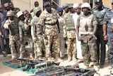 Nigerian president Goodluck Jonathan inspects seized Boko Haram weapons