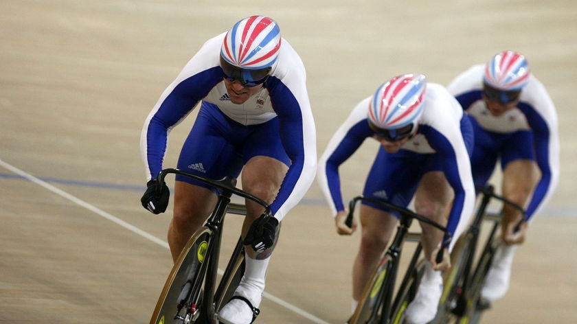 Towing the team: Chris Hoy leads team-mates Jason Kenny and Jamie Staff to gold in the men's team sprint.