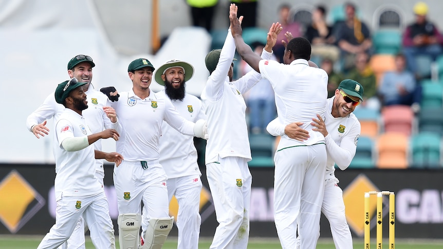 South Africa captain Faf du Plessis celebrates with Kagiso Rabada at Bellerive Oval in Hobart, on November 15 2016