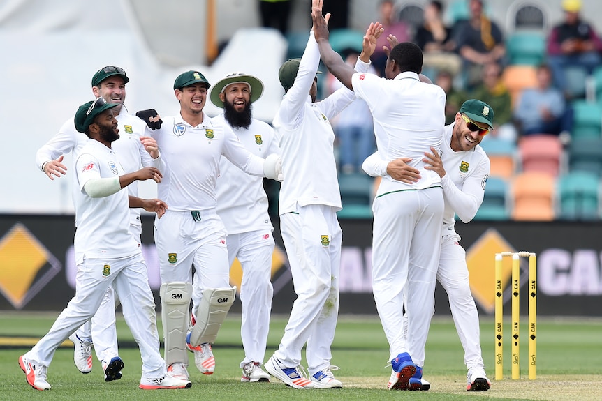South Africa's Kagiso Rabada celebrates with team-mates after the wicket of Australia's Callum Ferguson