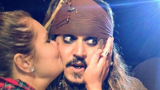 Whitney Aldridge kisses Johnny Depp