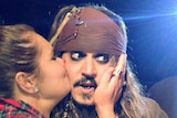 Whitney Aldridge kisses Johnny Depp