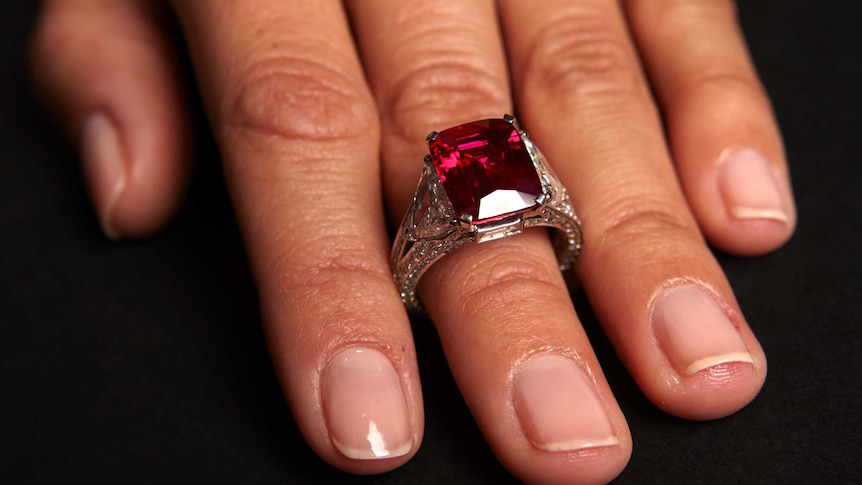 A model wears the "Graff Ruby" during an auction preview Sotheby's auction house in Geneva November 5, 2014.