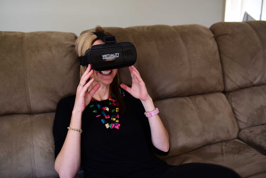 woman wearing virtual reality goggles