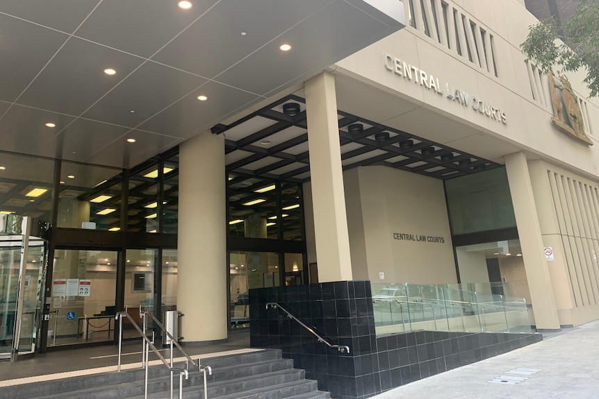 A wide shot of the front facade of the Central Law Courts building in Perth.