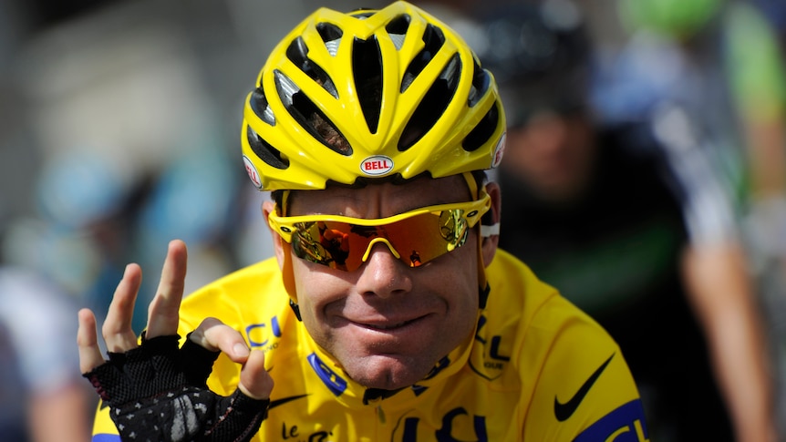 Cadel Evans gestures as he rides in the 95km and last stage of the 2011 Tour de France cycling race between Creteil and Paris.