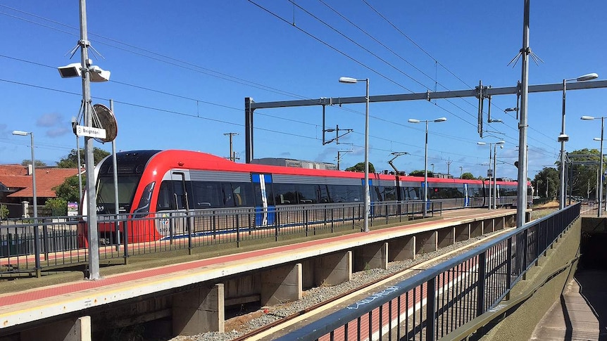 An electric train arrives at the station.