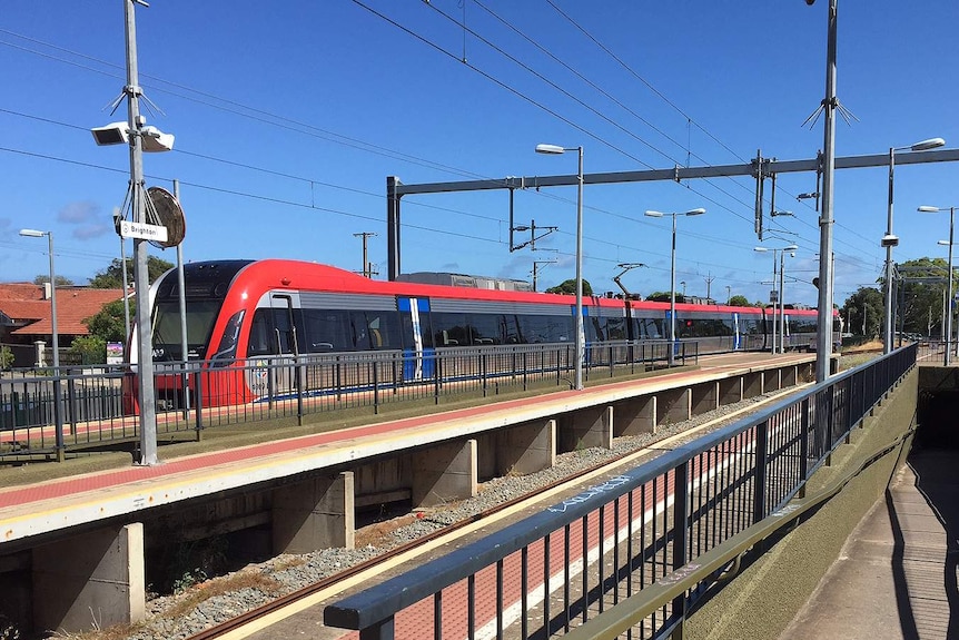 An electric train arrives at the station.