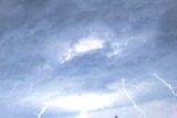 Multiple lightning strikes as the storm passed over Moorooka on Brisbane's southside yesterday.