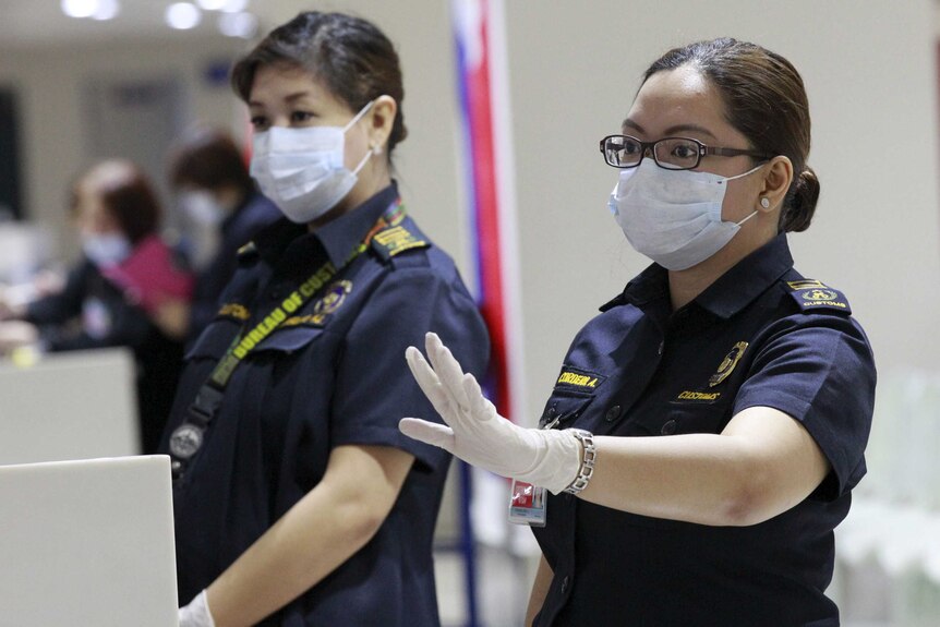 Customs inspectors at Ninoy Aquino International Airport in Manila