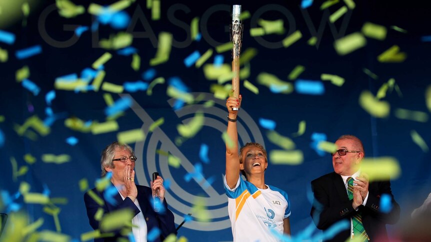 Allison Curbishley holds the Queen's Baton as it arrives in Glasgow