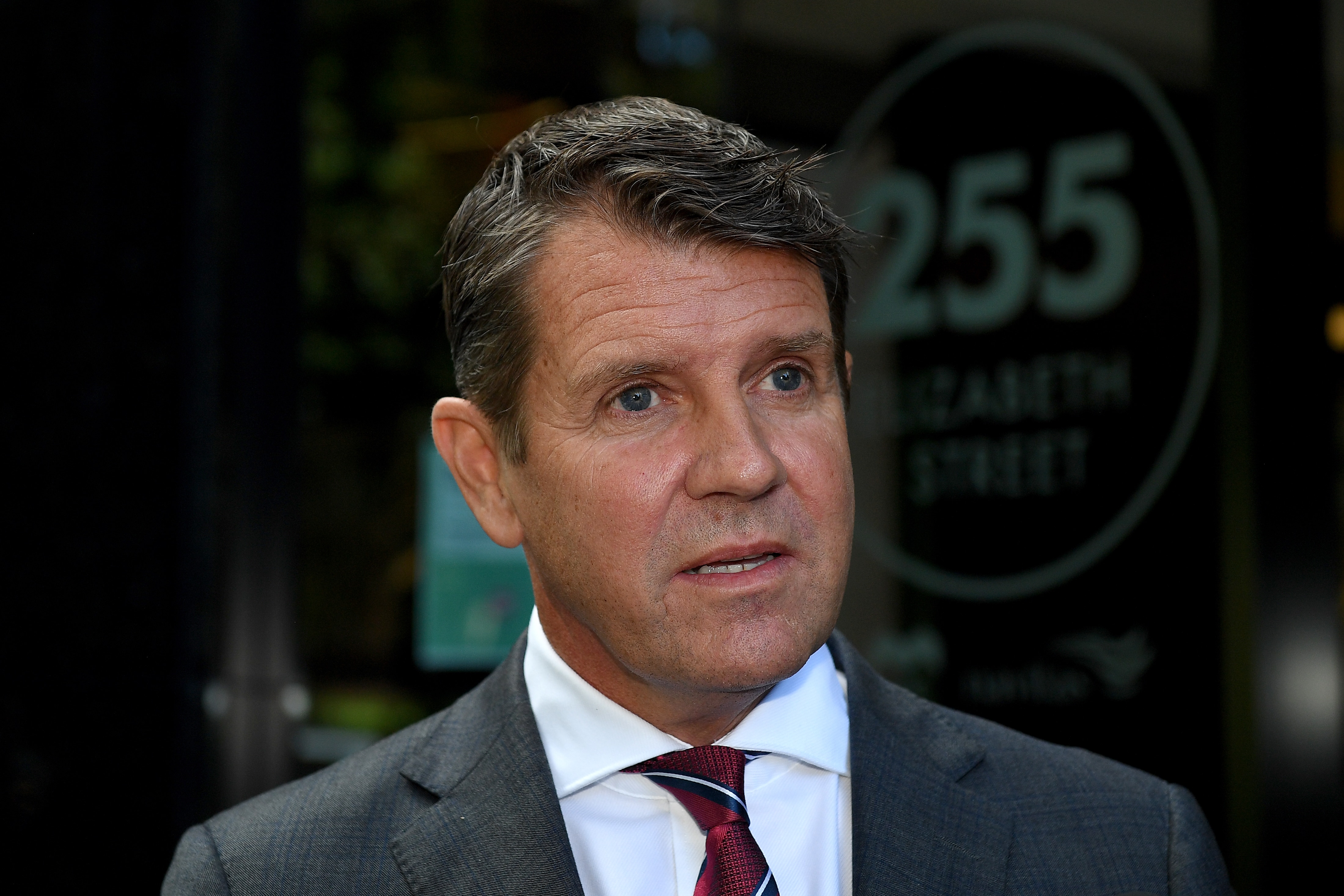 a man looking standing outdoors