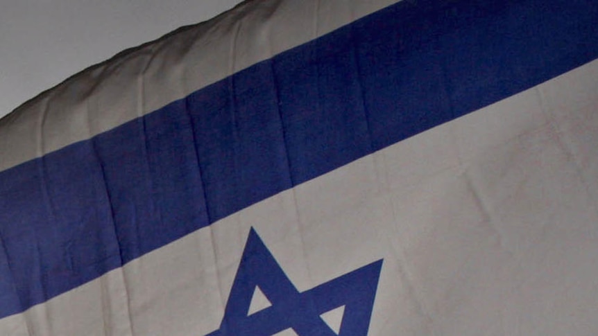 An Israeli flag flutters in the wind