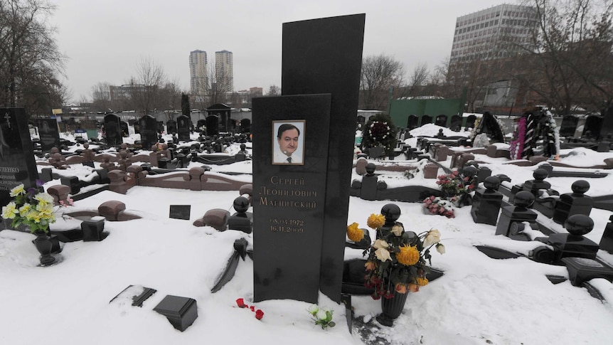 The snow-clad grave of Russian lawyer Sergei Magnitsky at a cemetery in Moscow.