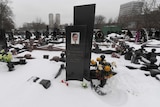 The snow-clad grave of Russian lawyer Sergei Magnitsky at a cemetery in Moscow.