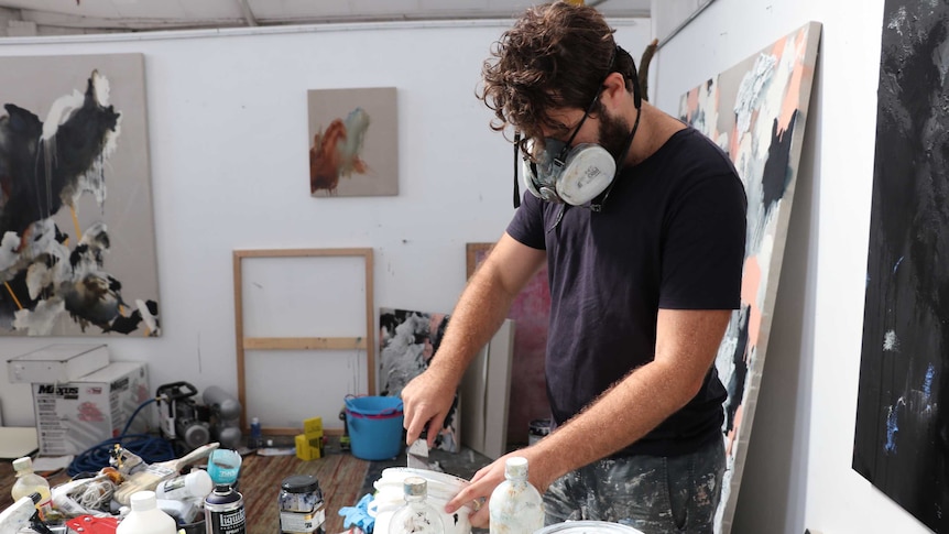 Artist Sam Holt in his studio