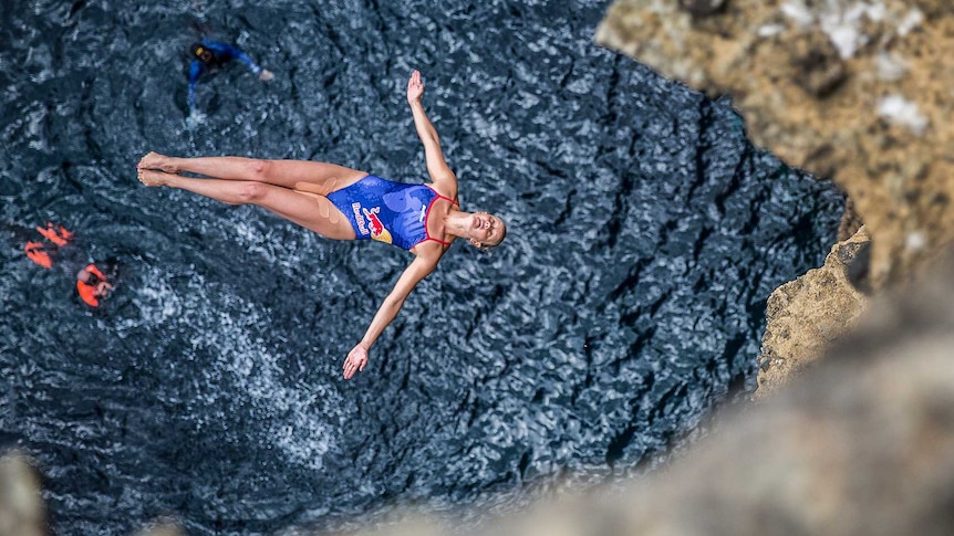 Australia's Rhiannan Iffland leaps off a rock face in Azores, Portugal, during the 2017 Red Bull Cliff Diving championships.