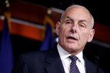 General John Kelly looks stern as he speaks at an official event.