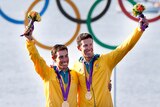 Mathew Belcher and Malcolm Page pose with their gold medals won in the men's 470 sailing.