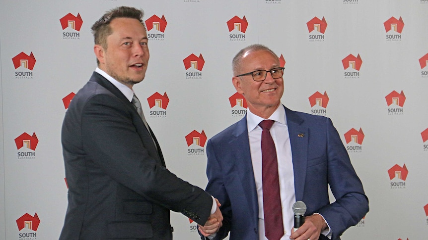 Businessman Elon Musk shakes hands with SA Premier Jay Weatherill.