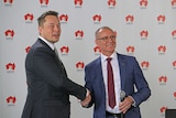 Businessman Elon Musk shakes hands with SA Premier Jay Weatherill.