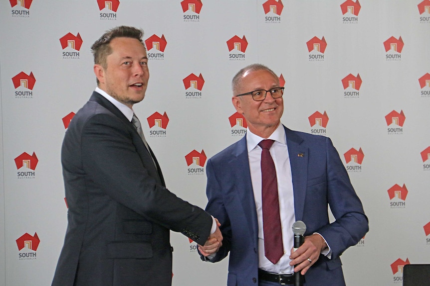 Businessman Elon Musk shakes hands with SA Premier Jay Weatherill.