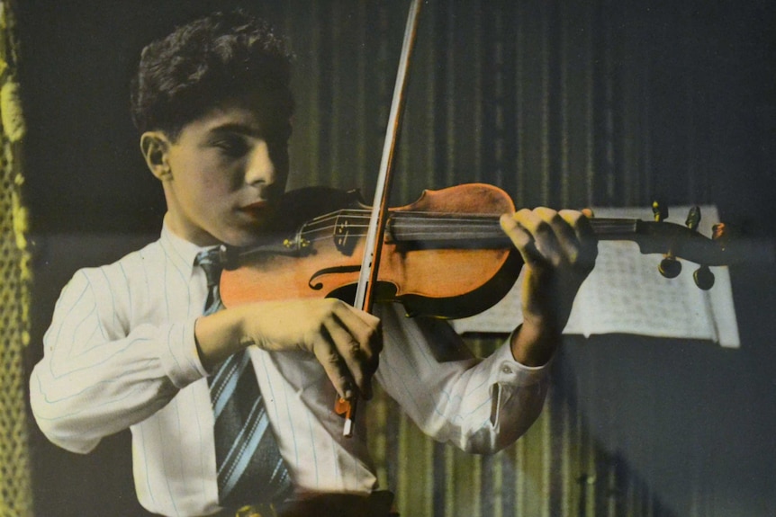 A colourised photo of Andy Factor playing the violin, circa 1939.