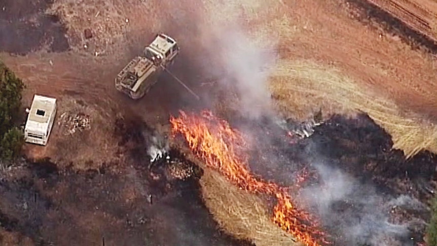 CFS crews douse a grass fire in the Adelaide Hills