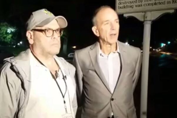 Journalist Dan Heyman (left) and his lawyer at a press conference after the incident