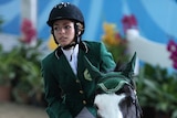 Dalma Rushdi Malhas of Saudi Arabia rides the horse Flash Top Hat at the 2010 Youth Olympic Games.