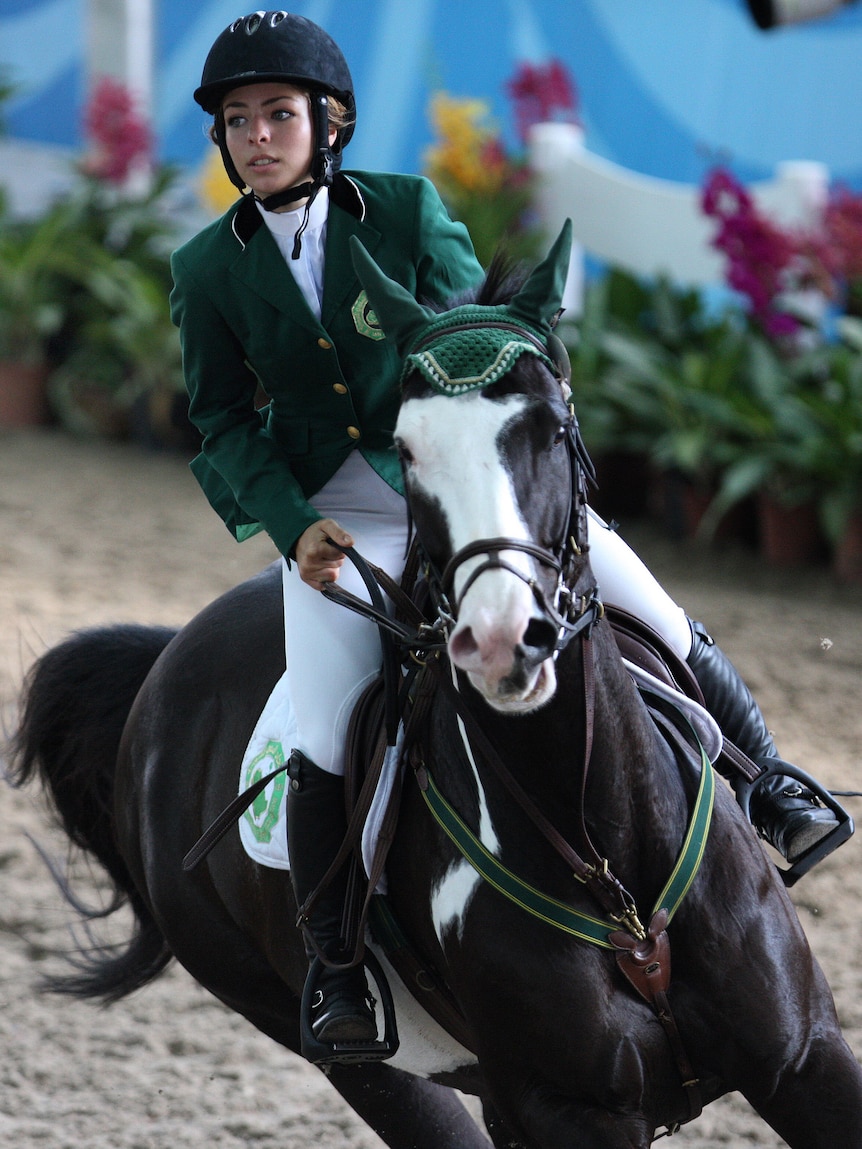 Dalma Rushdi Malhas of Saudi Arabia rides the horse Flash Top Hat at the 2010 Youth Olympic Games.