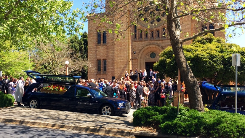 Mourners outside Luke Dorsett and Kate Goodchild's funeral at St Christopher's Cathedral at Forrest in Canberra's inner-south.