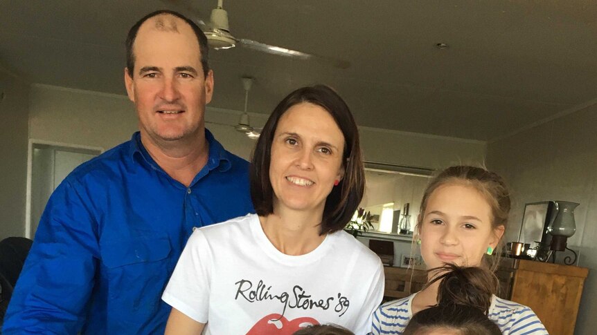 Charters Towers mother of four Natalie Kenny poses with her family at home