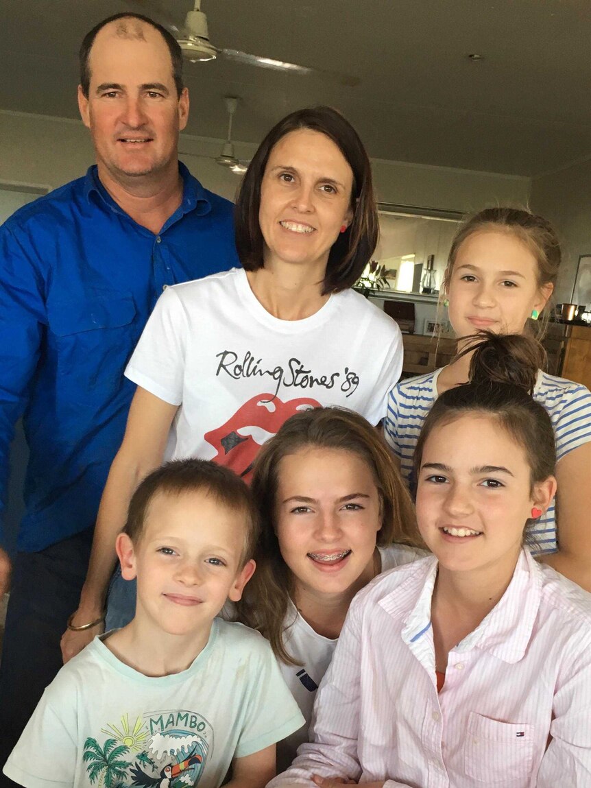 Charters Towers mother of four Natalie Kenny poses with her family at home