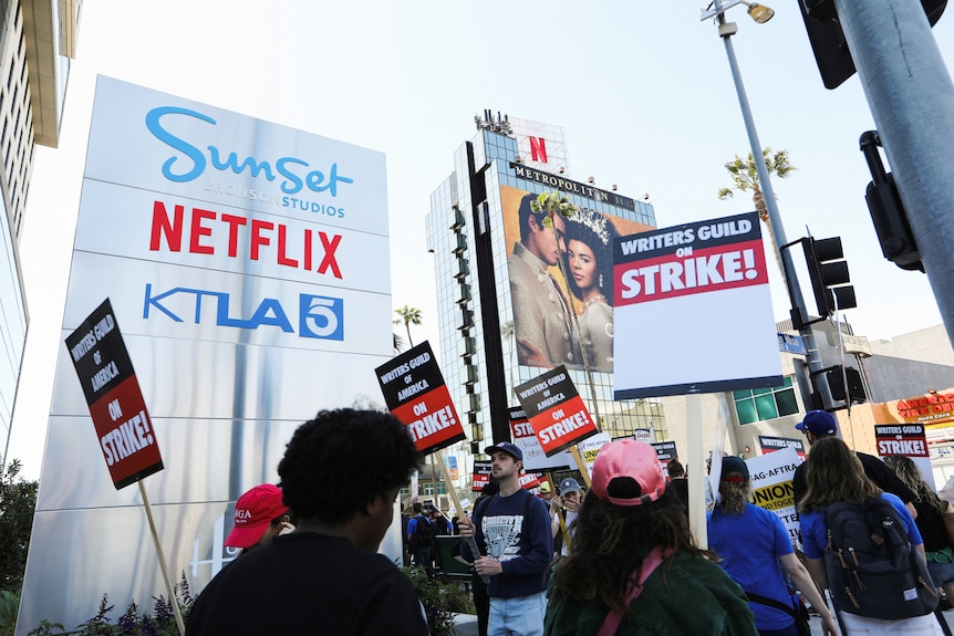 Workers and supporters of WGA protest outside Netflix offices in California.
