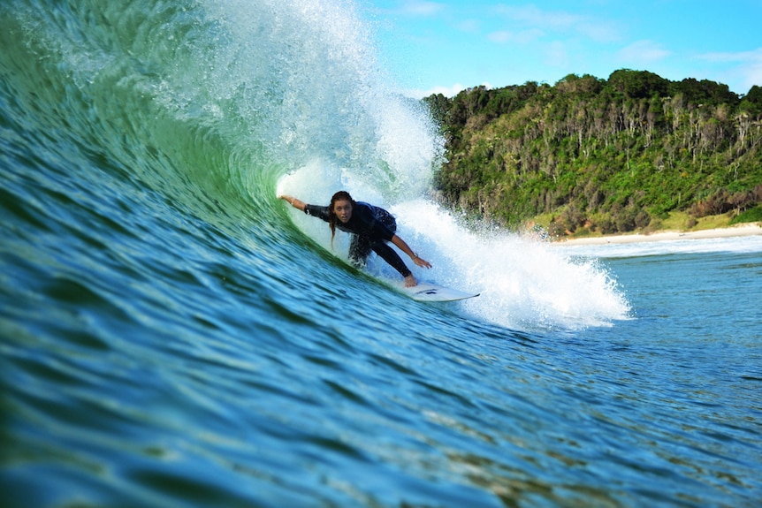 Brittani Nicholl surfing